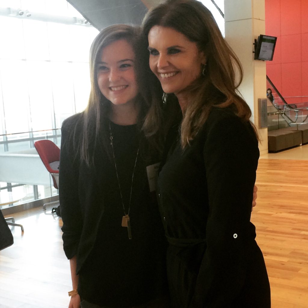 Maria Shriver meets with a young girl attending the summit. 